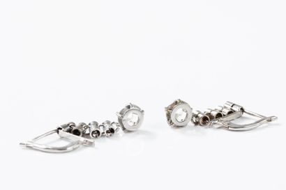 Pair of dangling earrings in white gold adorned...
