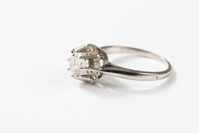 White gold and platinum solitaire ring centered...