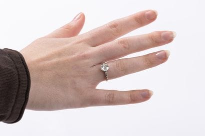 Gold and platinum ring centered on an old-cut...