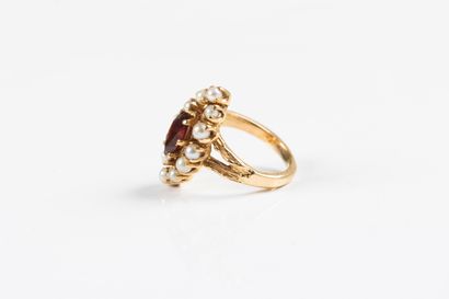 Yellow gold marquise ring centered with a...