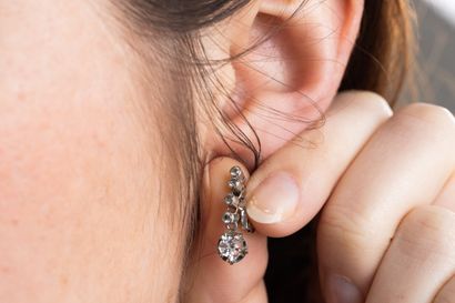 Pair of dangling earrings in white gold adorned...