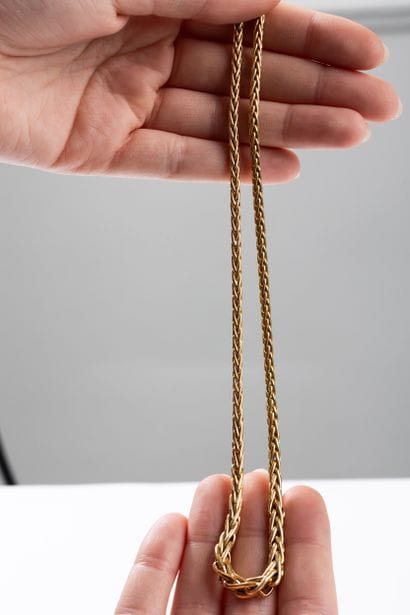 Yellow gold necklace with palm drop. Lobster...