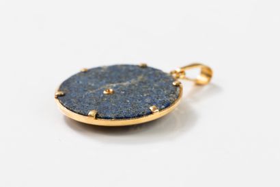 Round lapis lazuli pendant set with a gold...