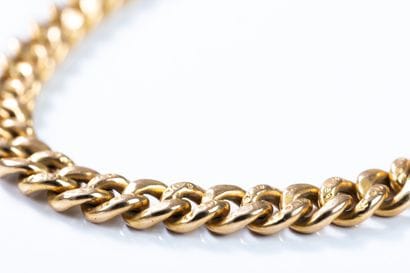 Yellow gold curb chain bracelet with chased...