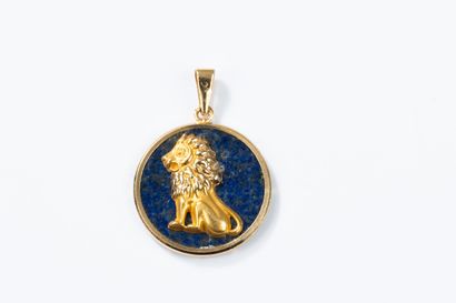 Round lapis lazuli pendant set with a gold...