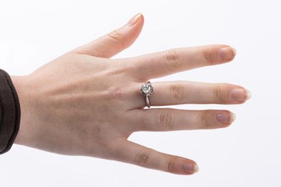 White gold and platinum solitaire ring centered...