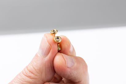 Pair of earrings in yellow gold, each set...