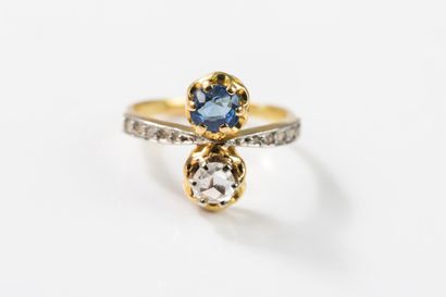 toi et moi gold ring set with a round sapphire...