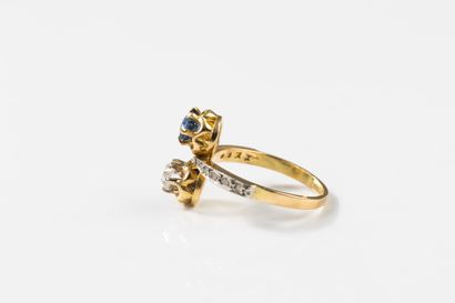 toi et moi gold ring set with a round sapphire...