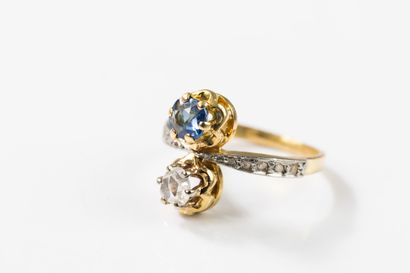 toi et moi gold ring set with a round sapphire...