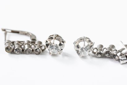 Pair of dangling earrings in white gold adorned...