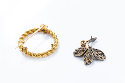 Brooch holding a removable silver floral...