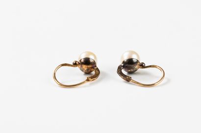 Pair of gold sleeper earrings, each punctuated...