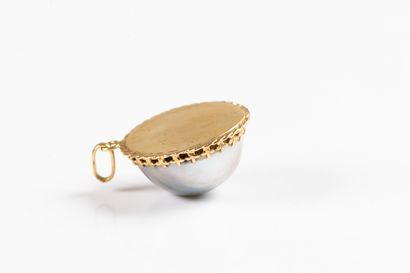 Yellow gold pendant adorned with a large...