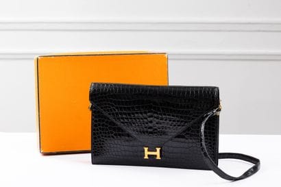 HERMES, Paris
Lydie clutch bag in black crocodile...