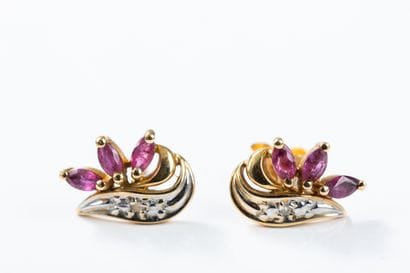 Pair of gold earrings each set with three...