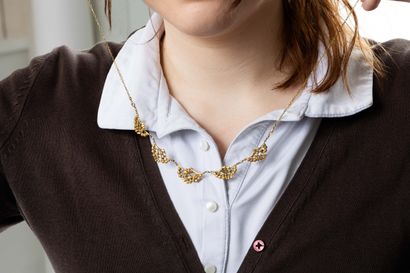 Yellow gold drapery necklace with foliate...