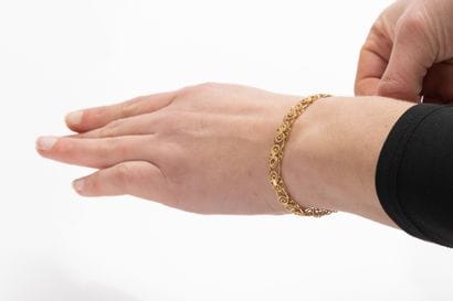 Yellow gold bracelet decorated with filigree...