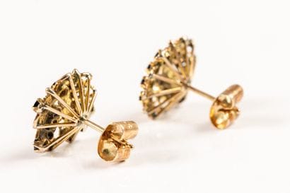 Pair of gold earrings set with sapphires...