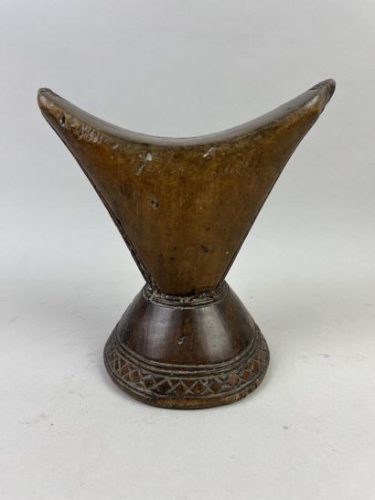Neck rest. Wood with a beautiful brown patina...