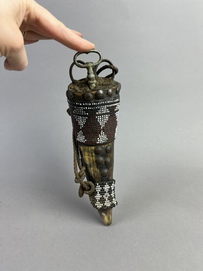 Mohara talisman horn, partially covered with...