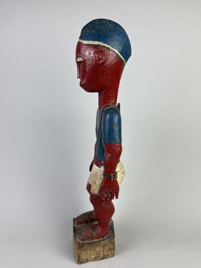 Colon statuette depicting a standing man...