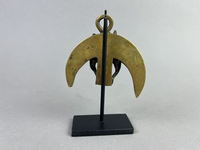 Crescent-shaped pendant with two figures,...