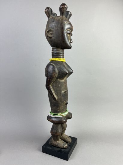 Standing female statue with arms detached...