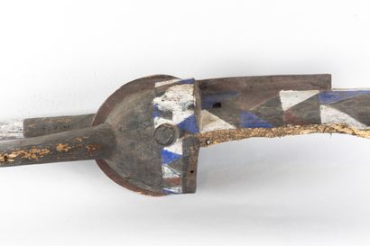 Large mask. The face is surmounted by large...
