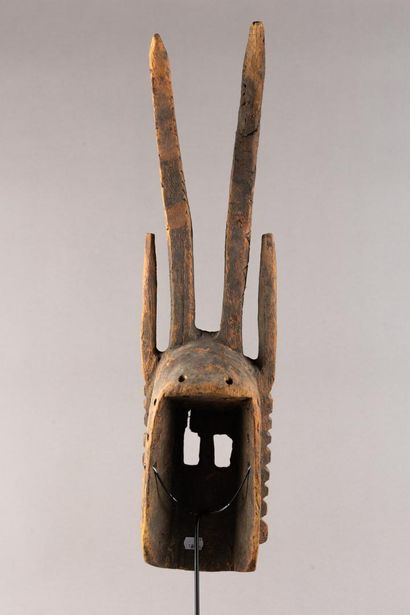 Wallu mask. The rectangular face is divided...