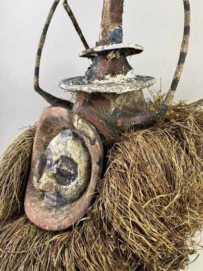 N'eemba helmet mask. Human face surmounted...