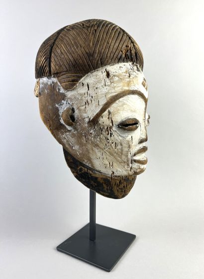 Okuyi facial mask, portrait of a young girl....