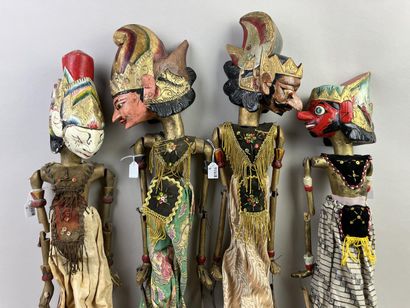 Four Wayang Golek rod puppets. The carved...