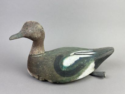 Antique wooden duck caller. Presence of its...