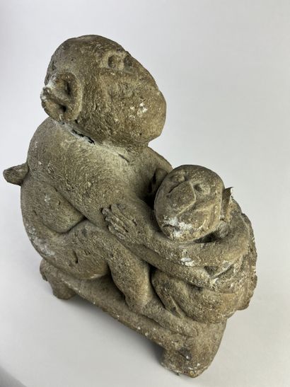 Sculpture depicting a simian figure holding...