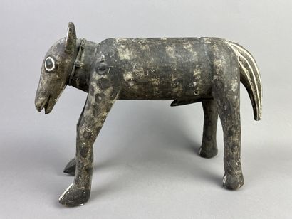 Sculpture of a horse resting on its four...