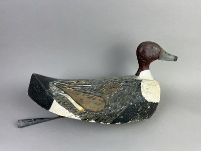 Antique wooden duck caller. Presence of its...