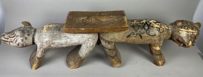 Seat composed of two animals side by side....