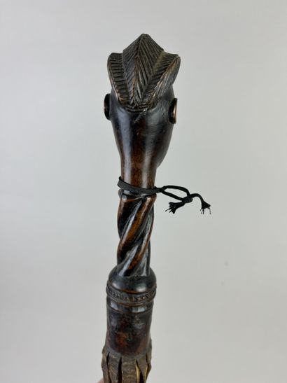 Flycatcher. The handle depicts a human head...