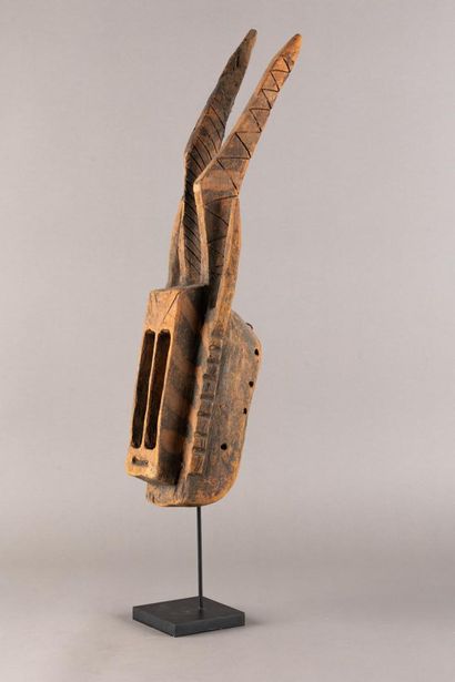 Wallu mask. The rectangular face is divided...