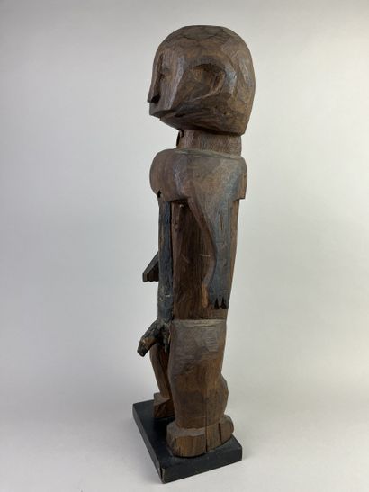 Male statue depicted standing with arms at...