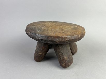Small stool on four legs. Brown patina wood....