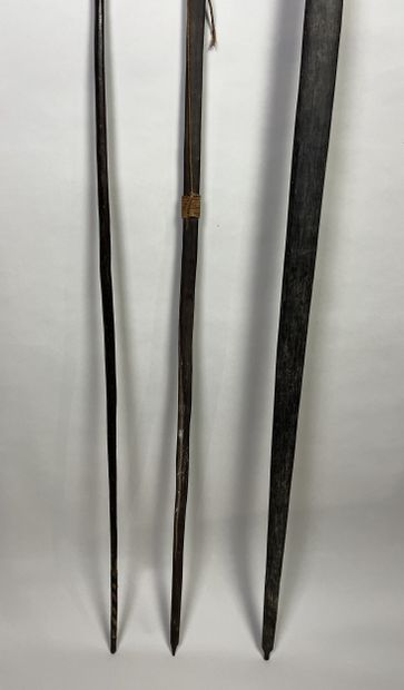 Three bows: One dark palmwood bow without...
