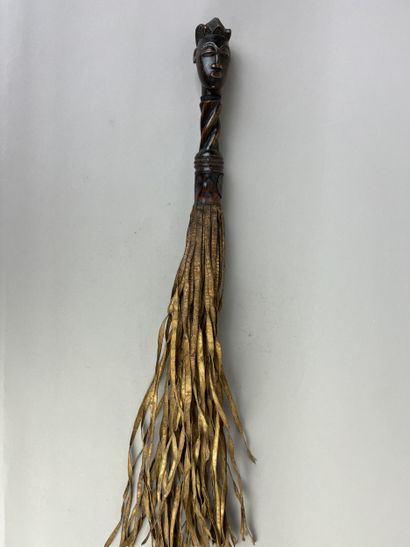 Flycatcher. The handle depicts a human head...