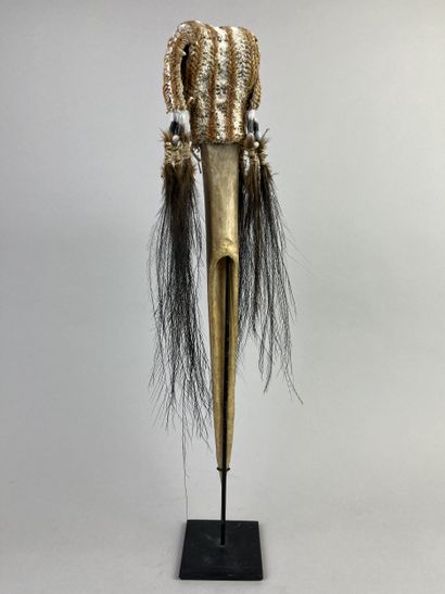 Dagger adorned at the top with a fiber cap...