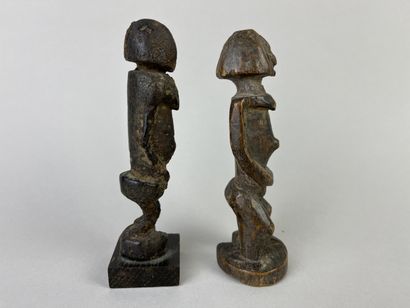 Two antique cubist-style small fetishes shown...