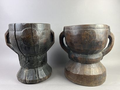 Two antique hourglass-shaped mortars decorated...