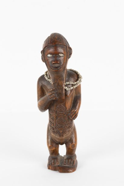 Mukuya ancestor. Male statuette, shown standing...