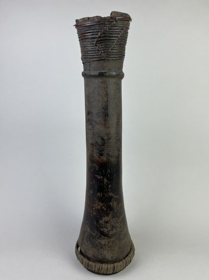 Hand drum (kundu) with flared ends and a...