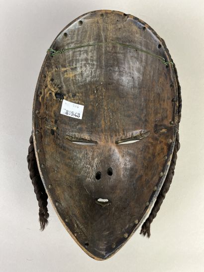 Mask with human face, a wolf painted black...